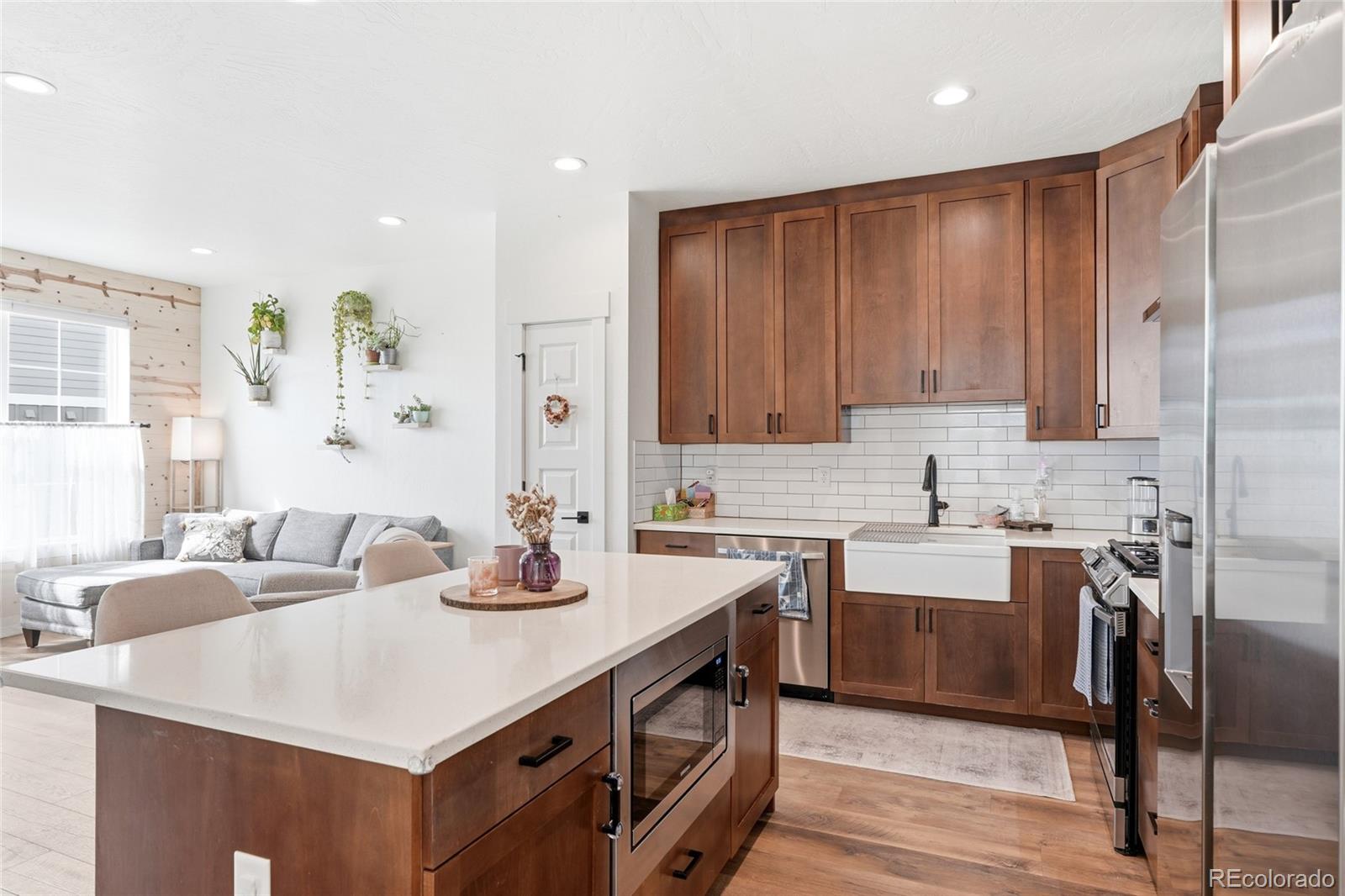 287 Dipper Court Berthoud, CO 80513 - Photo 9 of 29 a kitchen with a sink cabinets and window