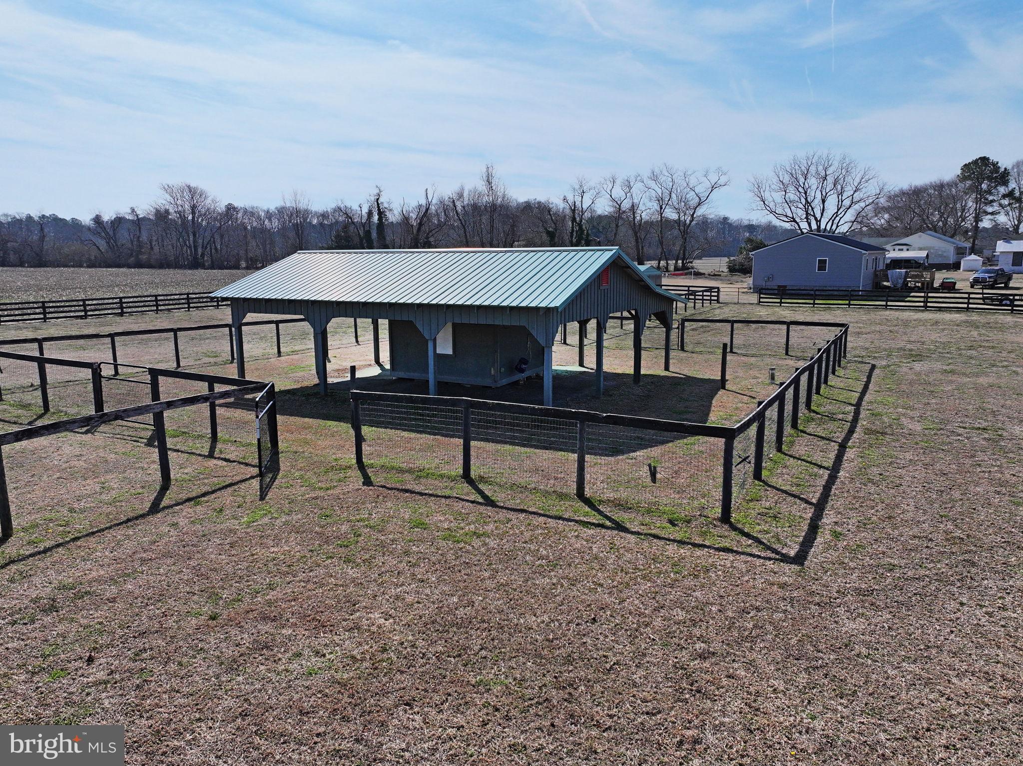 519 Whitehall Road Lancaster, VA 22503 - Photo 7 of 46 a view of a chairs and table in the terrace