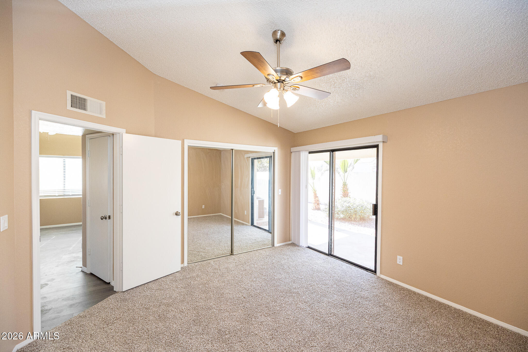 542 South Higley Road, Unit 104 Mesa, AZ 85206 - Photo 12 of 22 a view of an empty room with a window