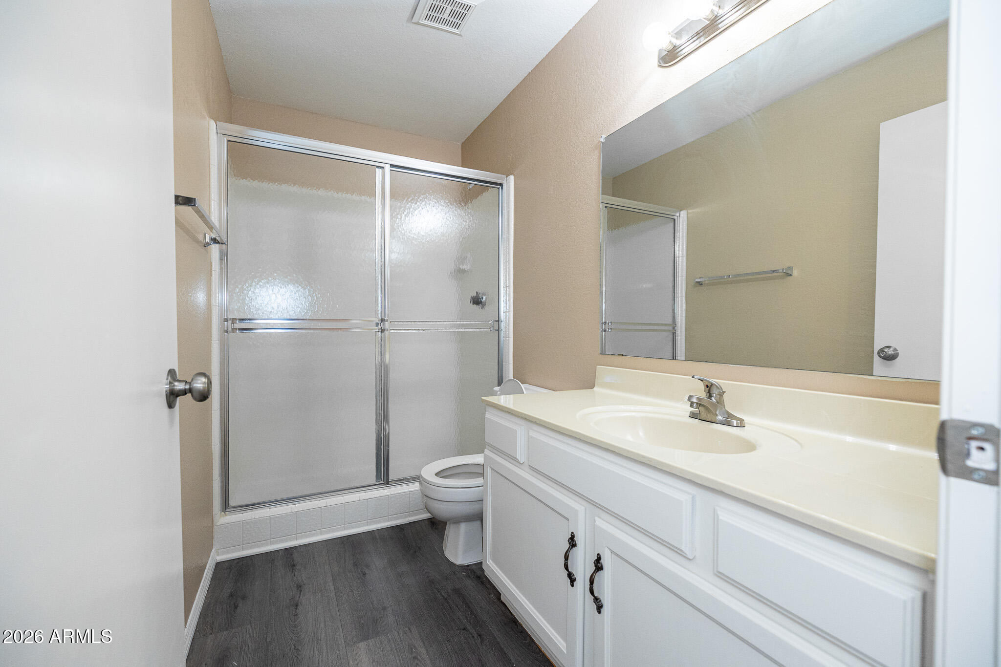 542 South Higley Road, Unit 104 Mesa, AZ 85206 - Photo 13 of 22 a bathroom with a sink a toilet and shower
