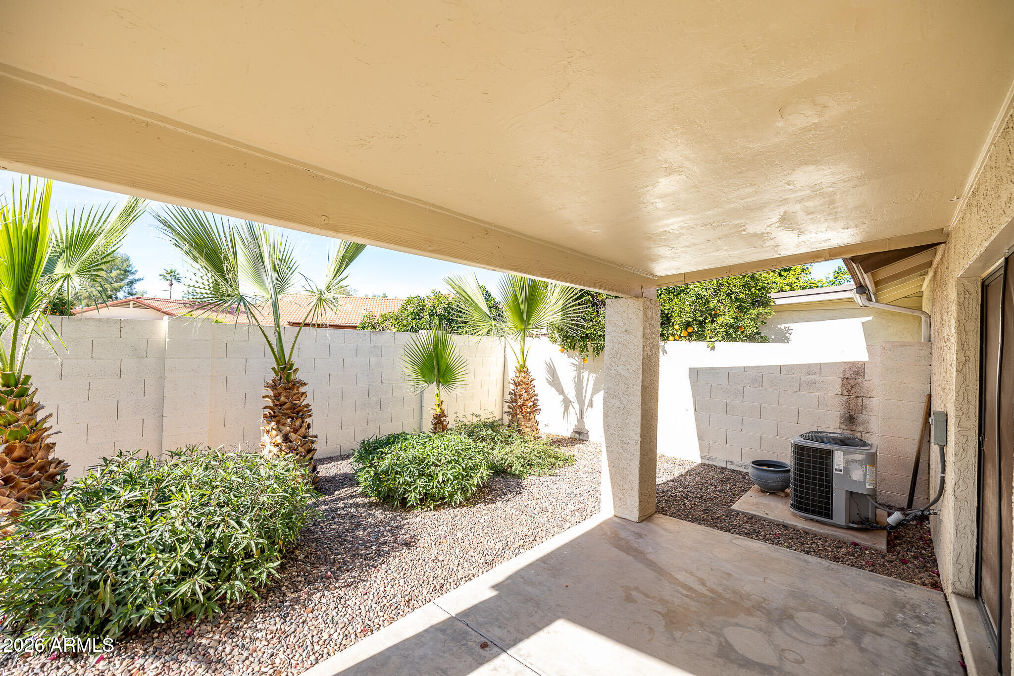 542 South Higley Road, Unit 104 Mesa, AZ 85206 - Photo 19 of 22 a front view of a house with garden