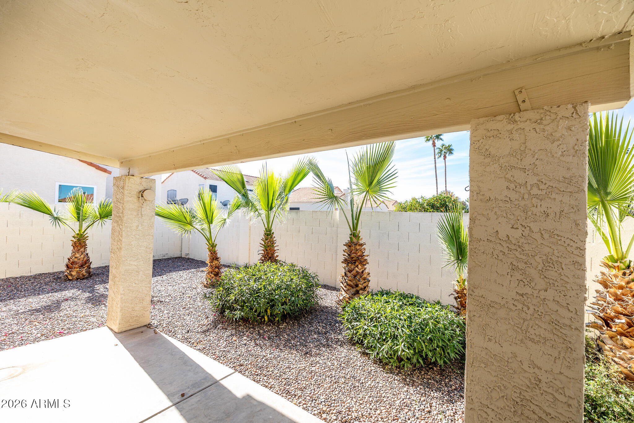 542 South Higley Road, Unit 104 Mesa, AZ 85206 - Photo 20 of 22 a front view of a house with garden