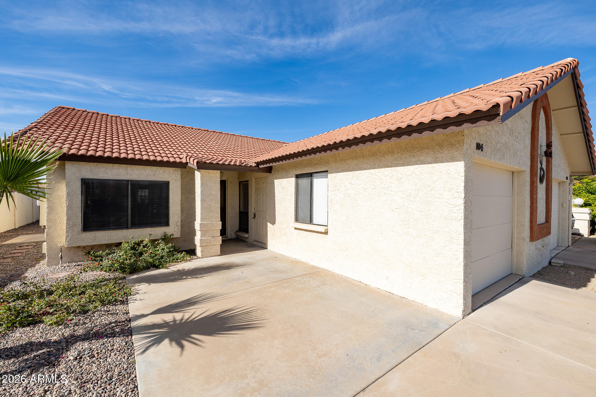 542 South Higley Road, Unit 104 Mesa, AZ 85206 - Photo 3 of 22 a front view of a house with garden