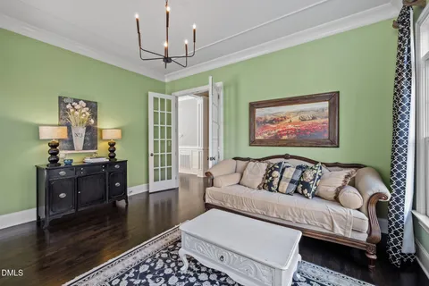 a view of a livingroom with furniture and a flat screen tv