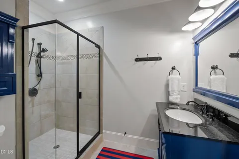 an aerial view of residential houses with outdoor space and swimming pool