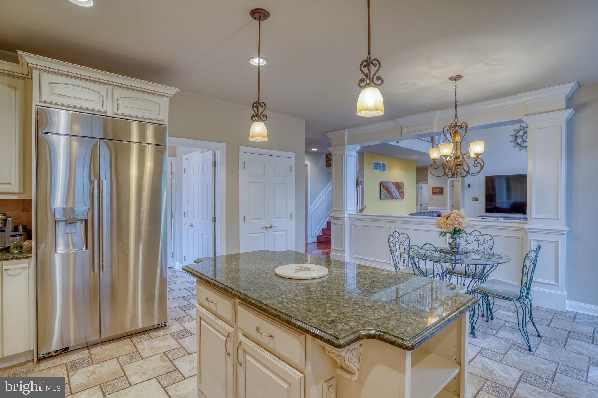 357 Willits Way Garnet Valley, PA 19060 - Photo 26 of 63 a kitchen with stainless steel appliances granite countertop a sink refrigerator and cabinets