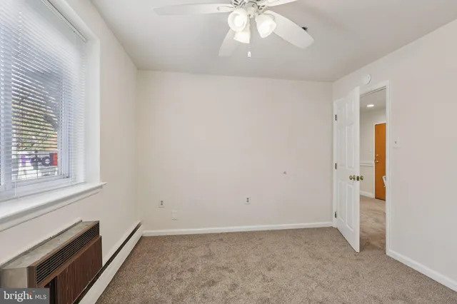 a view of an empty room with a window