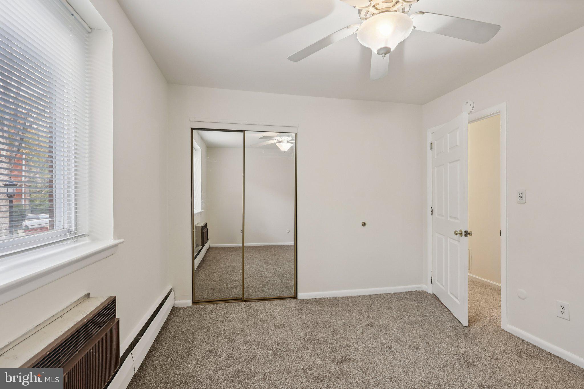 1600 Church Road, Unit C111 Wyncote, PA 19095 - Photo 15 of 24 wooden floor in an empty room with a window