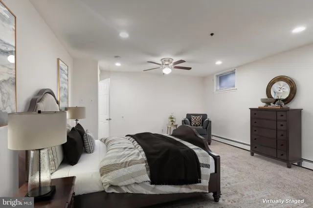 a bed room with a bed and a lamp