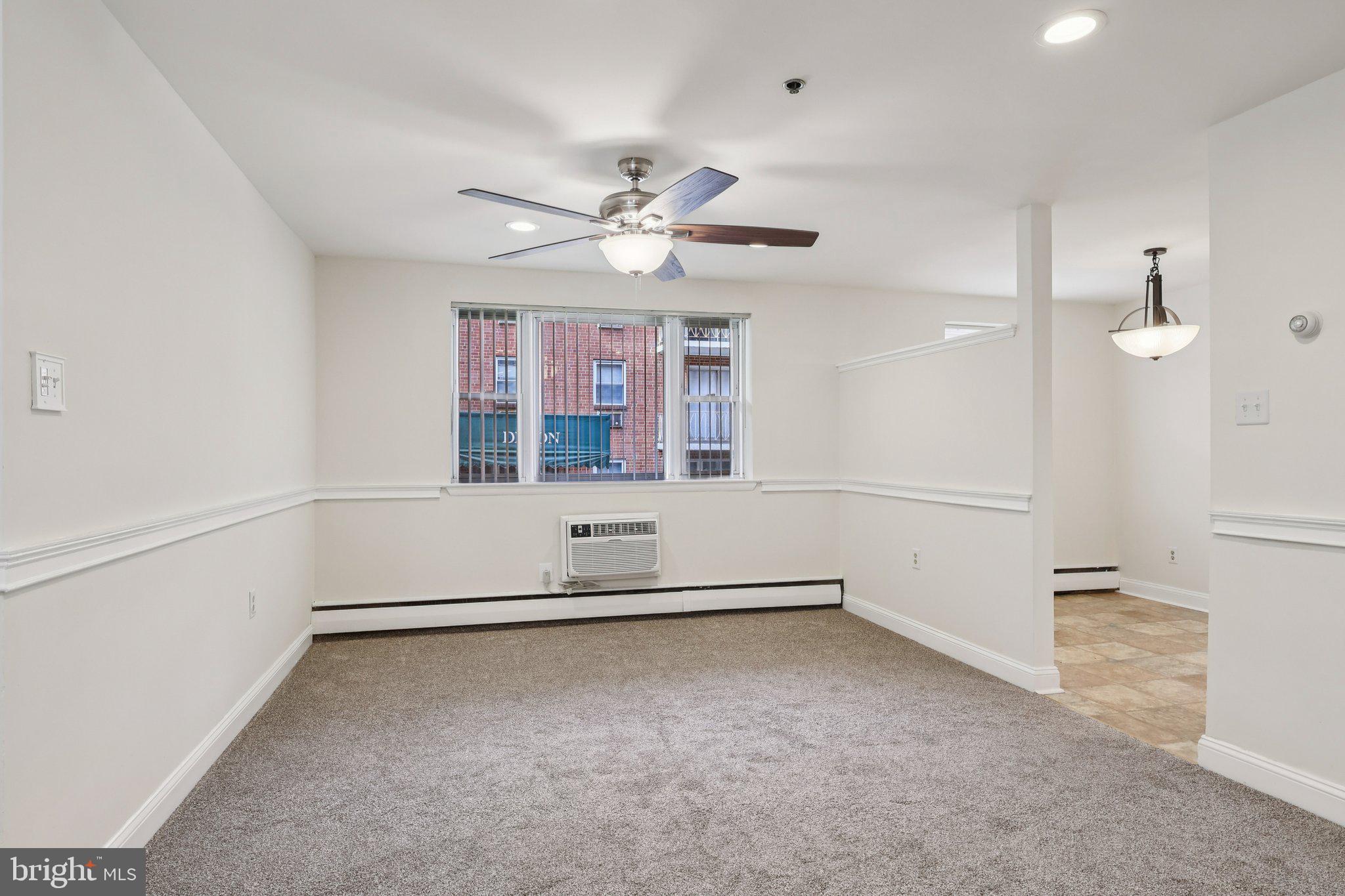 1600 Church Road, Unit C111 Wyncote, PA 19095 - Photo 3 of 24 wooden floor in an empty room with a window