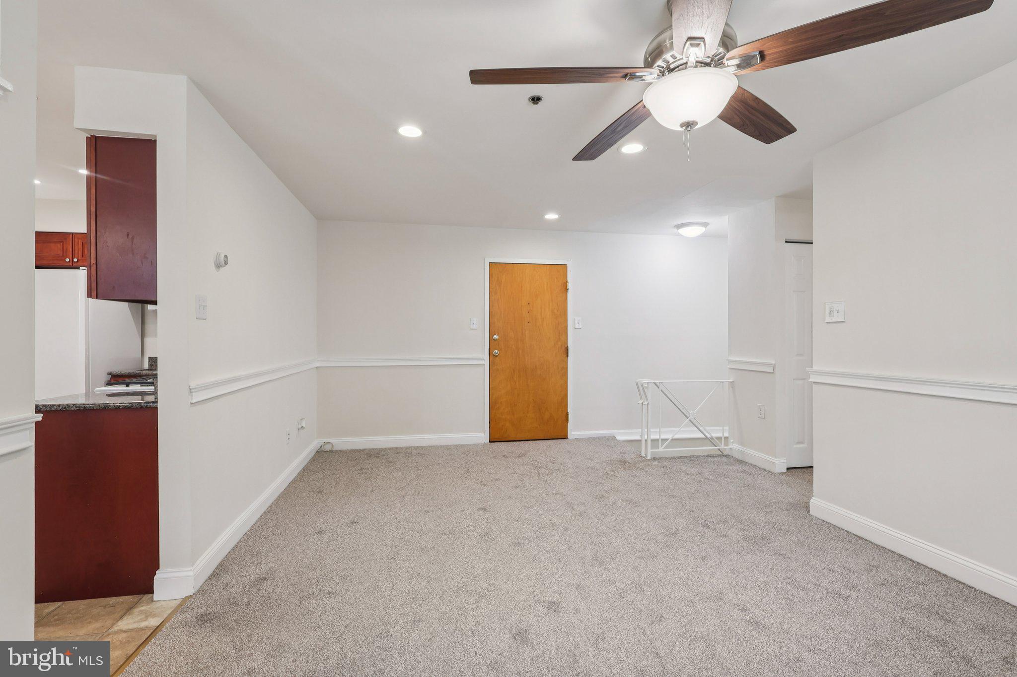 1600 Church Road, Unit C111 Wyncote, PA 19095 - Photo 4 of 24 wooden floor in an empty room with a window