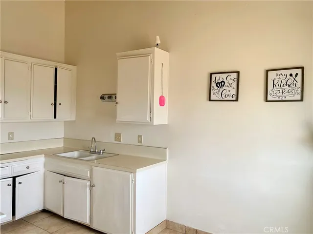 a bathroom with a sink vanity and mirror
