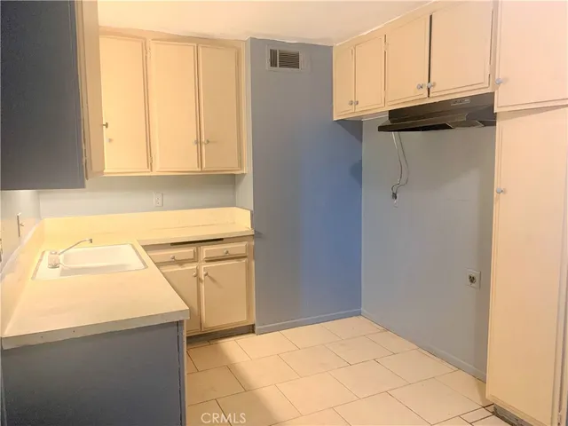 a view of a kitchen with a sink