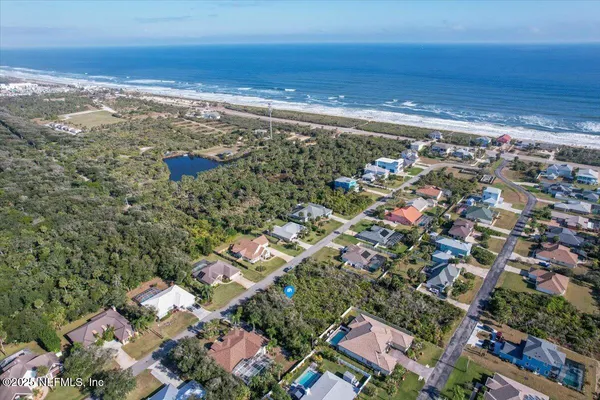an aerial view of beach and ocean