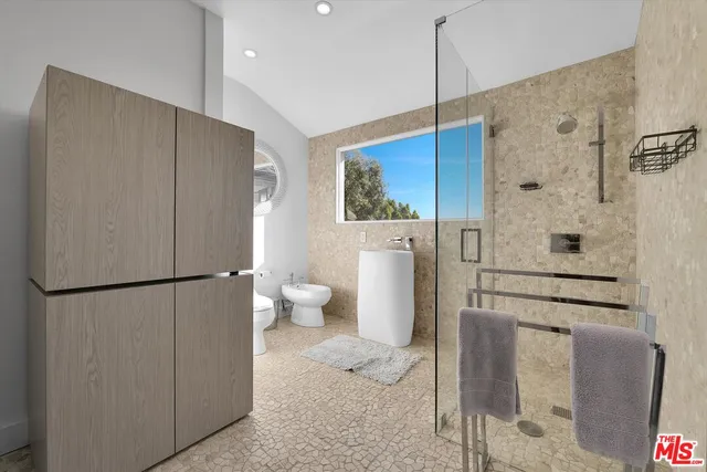 a bathroom with a shower and a toilet