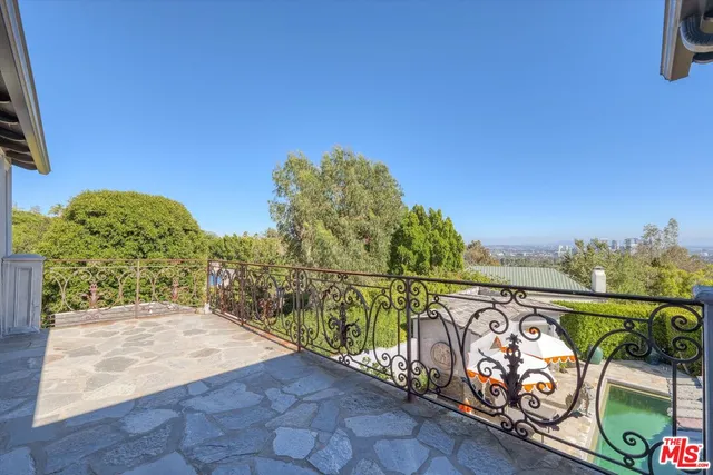a view of a balcony with city view