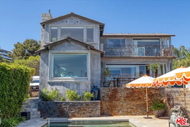 a front view of a house with an outdoor space