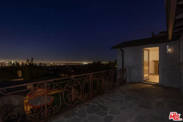 a view of balcony with furniture