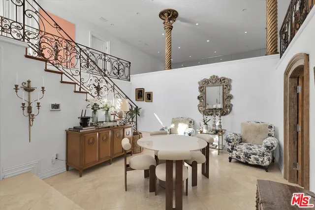 a view of a livingroom with furniture and entryway