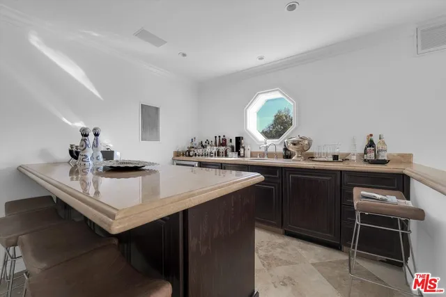 a kitchen with a sink and a stove