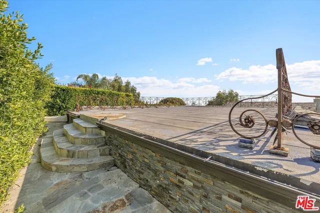 a view of a swimming pool with a yard