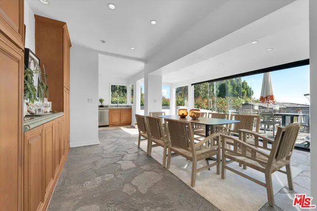 a view of a dining room with furniture window and outside view