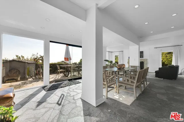 a view of a dining room with furniture large garden view and a living room