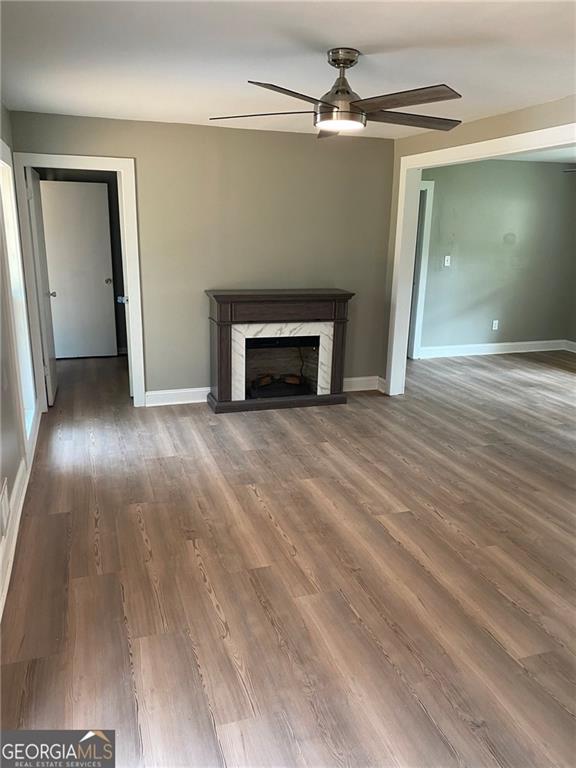 4029 Winding Way Macon, GA 31204 - Photo 13 of 24 wooden floor fireplace and natural light in room