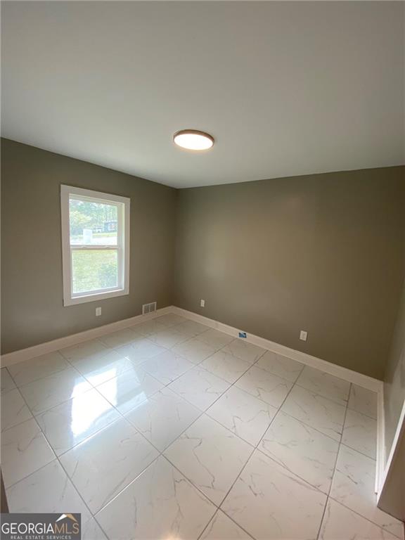 4029 Winding Way Macon, GA 31204 - Photo 5 of 24 a view of an empty room with a window