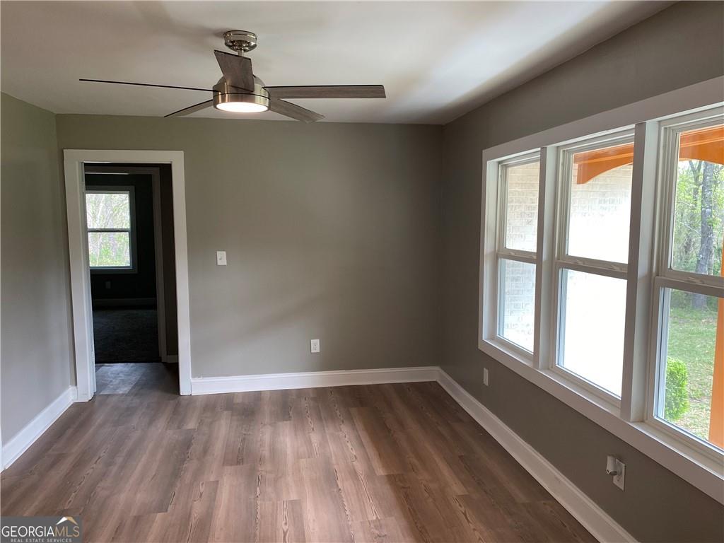 4029 Winding Way Macon, GA 31204 - Photo 6 of 24 wooden floor in an empty room with a window