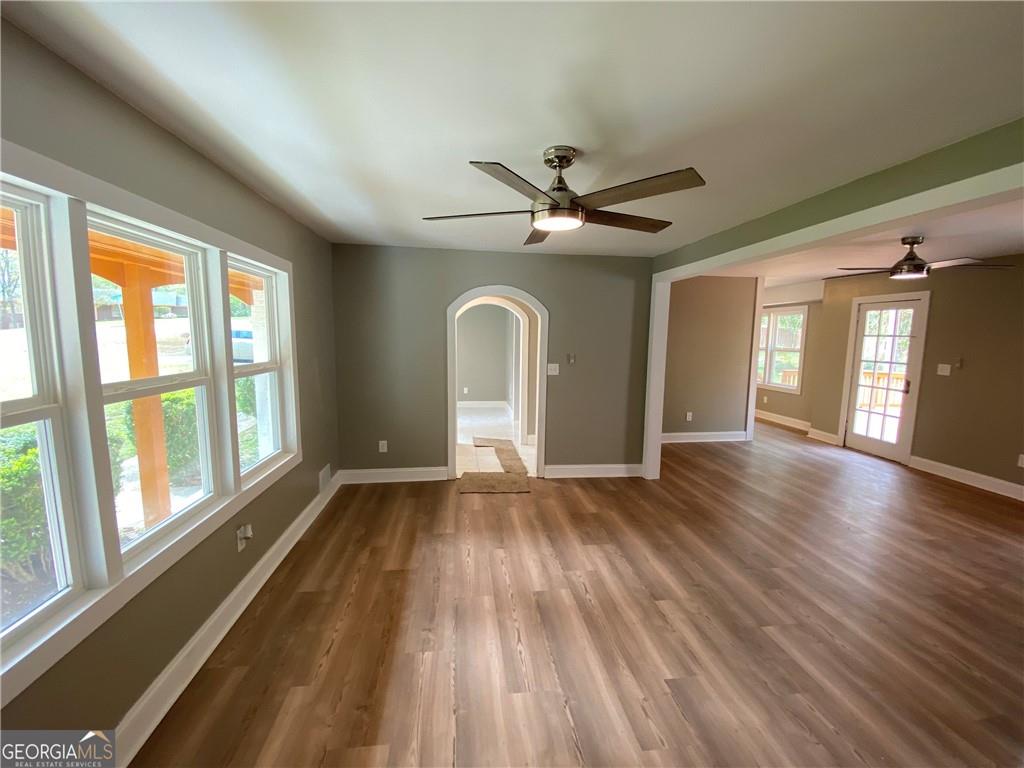4029 Winding Way Macon, GA 31204 - Photo 7 of 24 a view of an empty room with wooden floor and a window