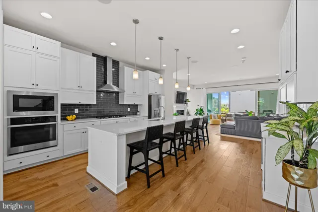 a bathroom with a double vanity sink mirror and shower