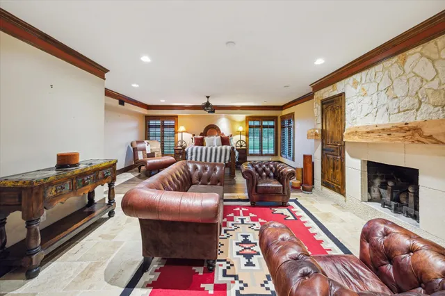 a living room with furniture fireplace and flat screen tv