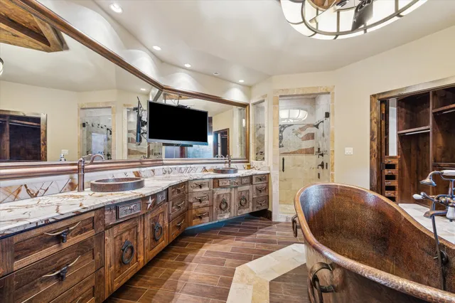 a large bathroom with a large tub and sink