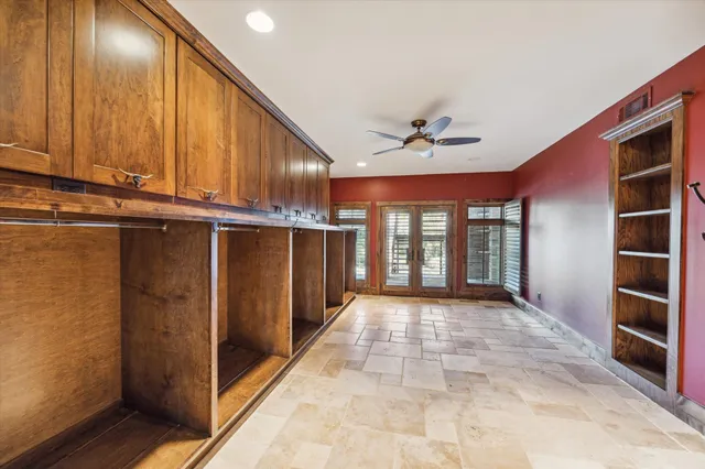 a view of a hallway with a window and a kitchen