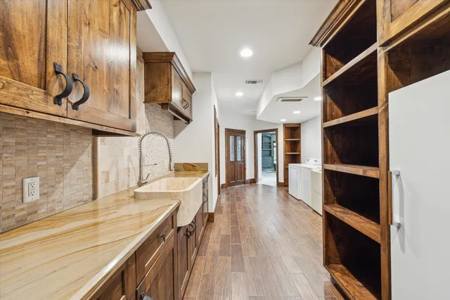 a view of a kitchen with a sink and microwave