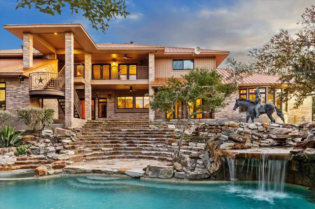 front view of a building with a garden