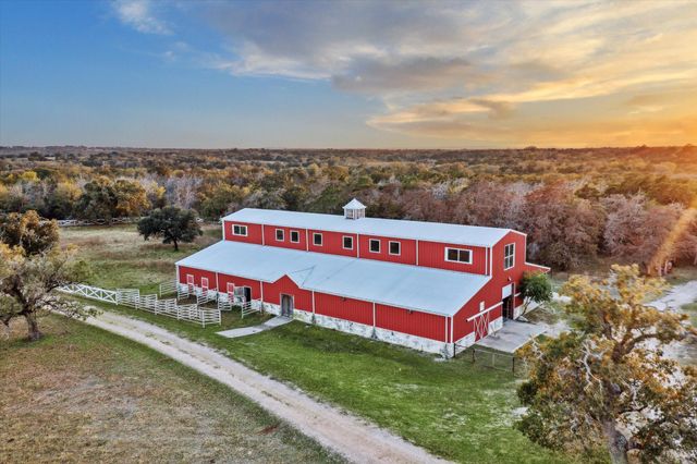 a view of a park with large trees
