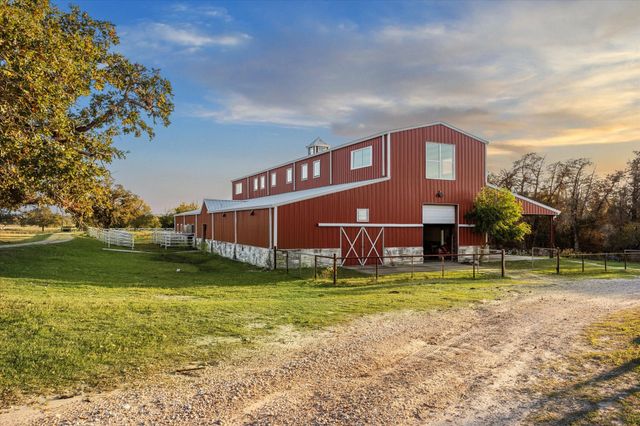 a view of a house with a yard porch and sitting area