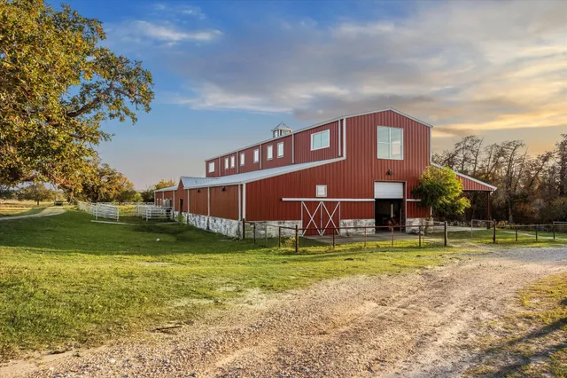 a view of a house with a yard porch and sitting area