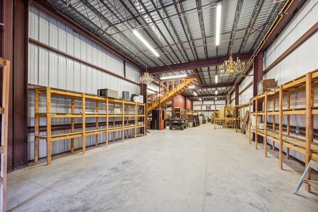 a view of an empty room with wooden walls
