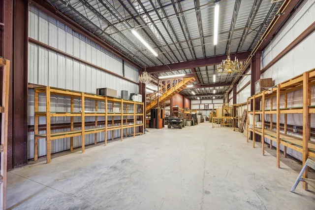 a view of an empty room with wooden walls
