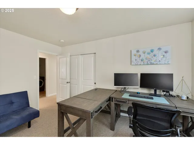 a view of a workspace with furniture