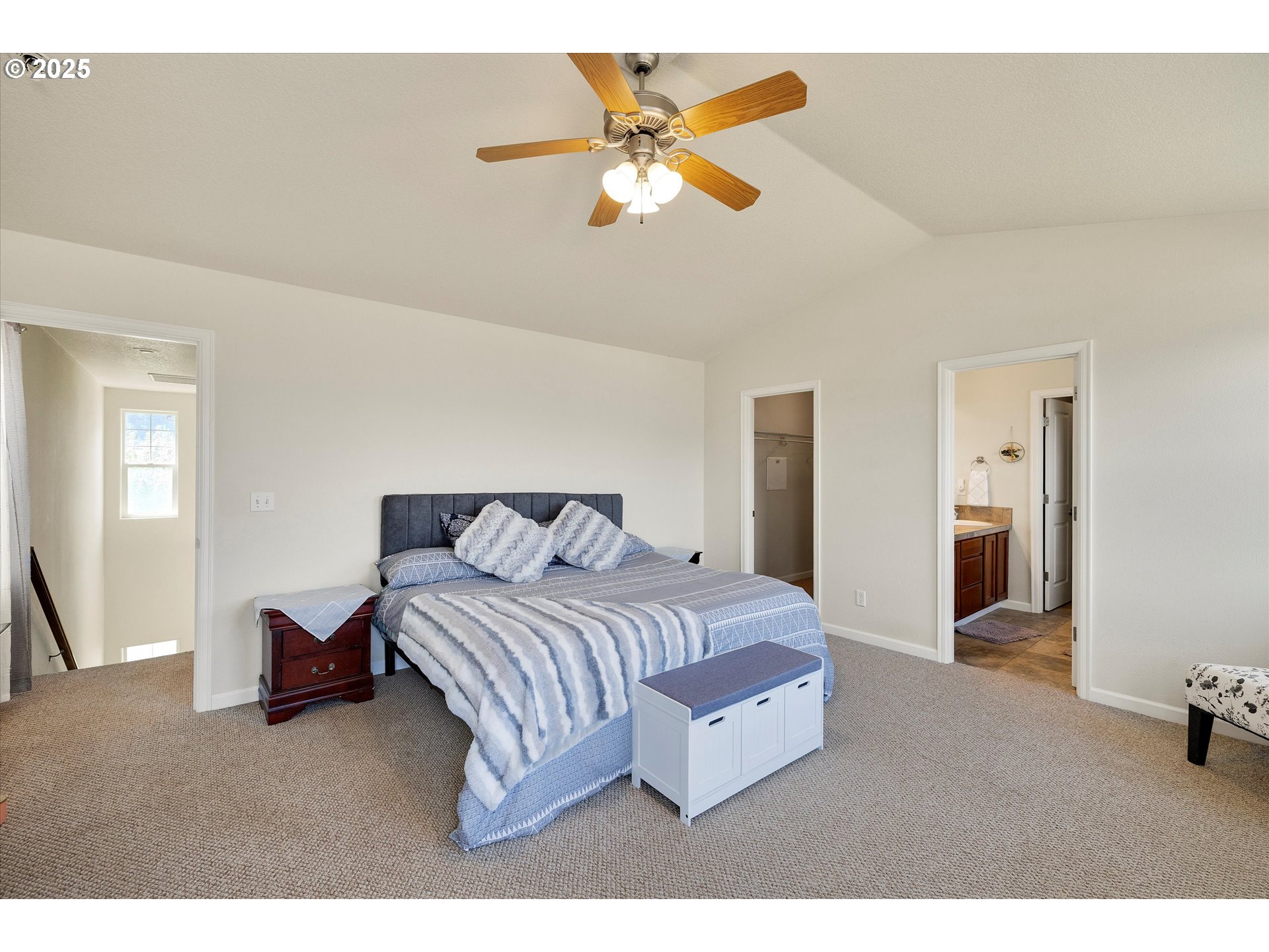 1153 Chinookan Drive Cascade Locks, OR 97014 - Photo 17 of 27 a bedroom with a bed and a ceiling fan
