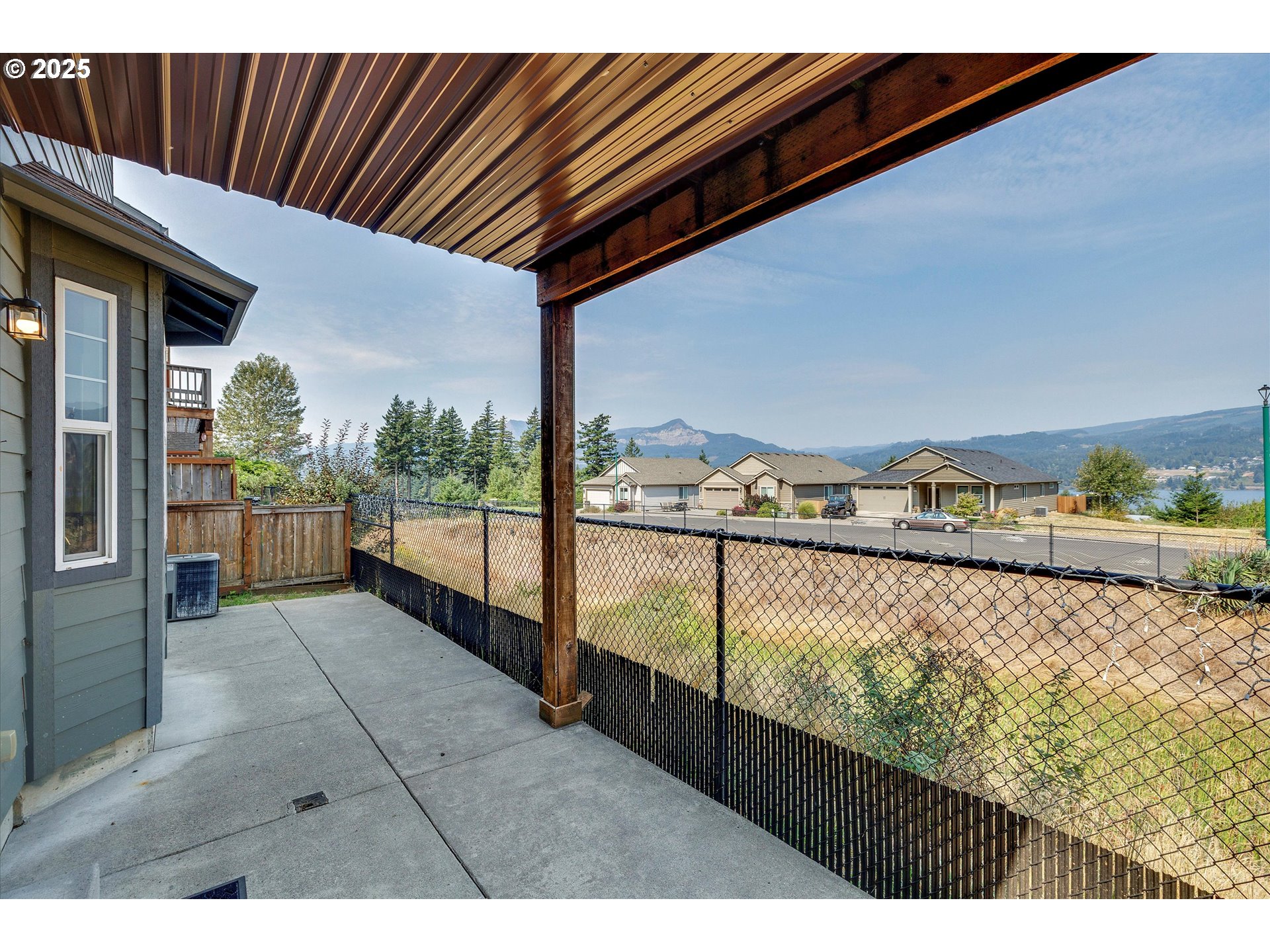 1153 Chinookan Drive Cascade Locks, OR 97014 - Photo 23 of 27 a view of balcony with floor to ceiling windows with wooden floor