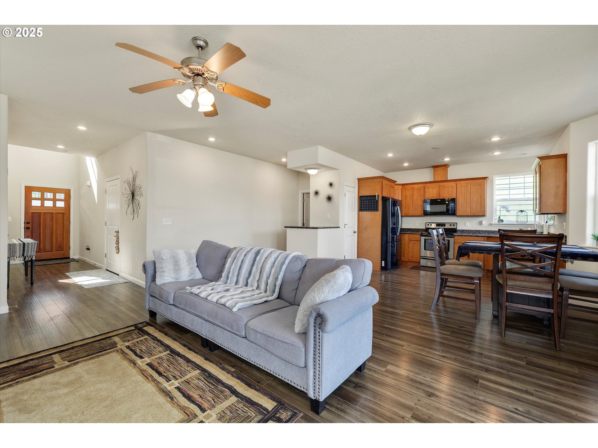 1153 Chinookan Drive Cascade Locks, OR 97014 - Photo 6 of 27 a living room with furniture and kitchen view
