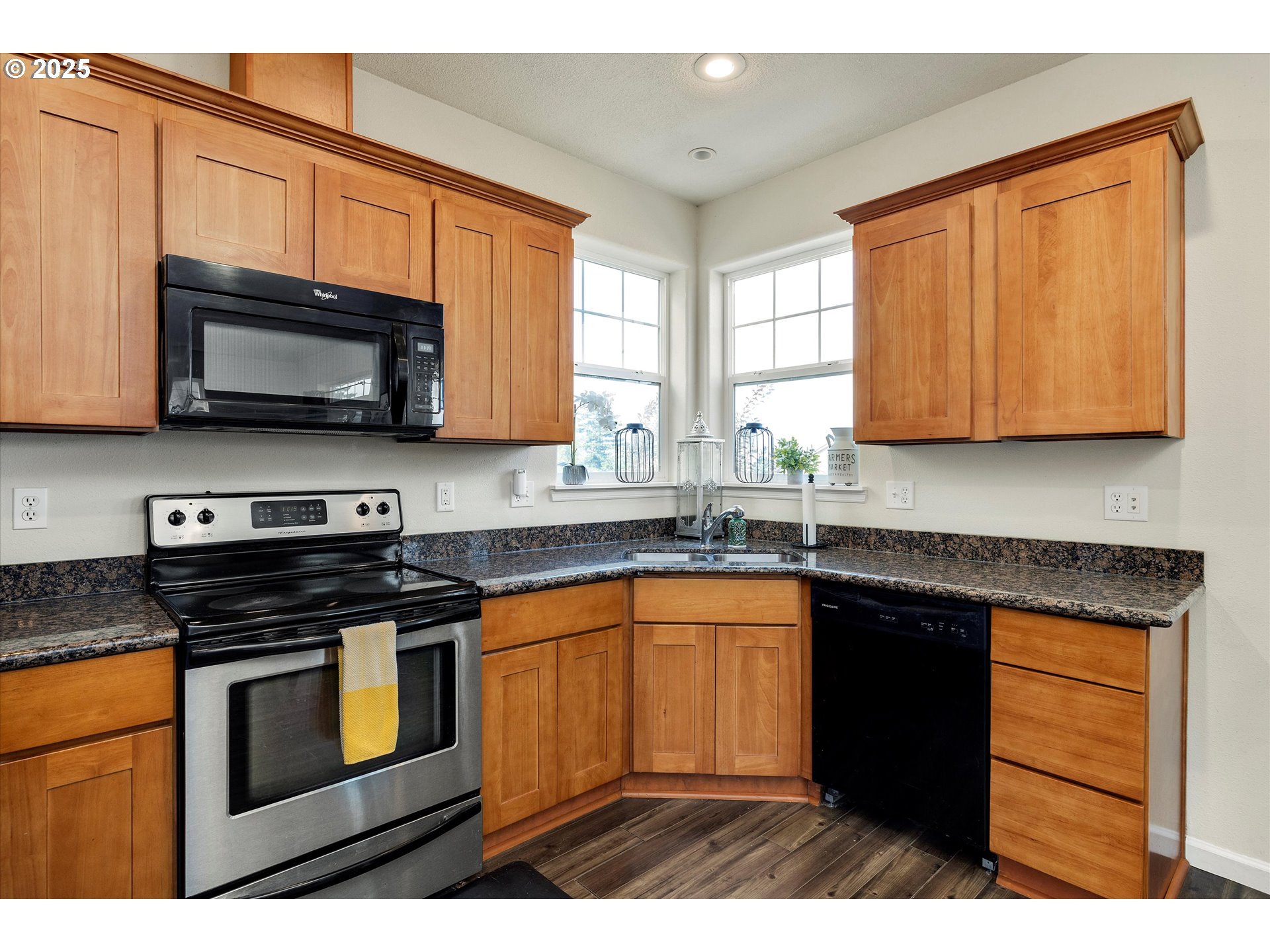 1153 Chinookan Drive Cascade Locks, OR 97014 - Photo 9 of 27 a kitchen with stainless steel appliances granite countertop wooden cabinets and a stove top oven