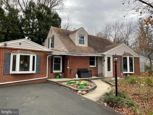 a front view of a house with yard