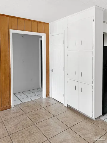a kitchen with a sink appliances and cabinets