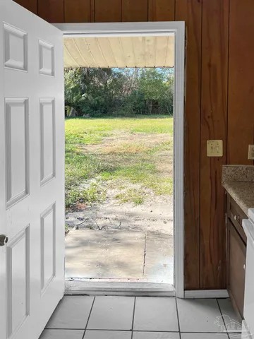 a view of an empty room and a window
